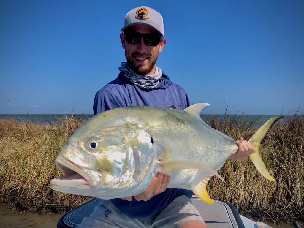 Matt, from Colorado, with a mean Jack Crevalle caught on the flats of Southeast Louisiana.